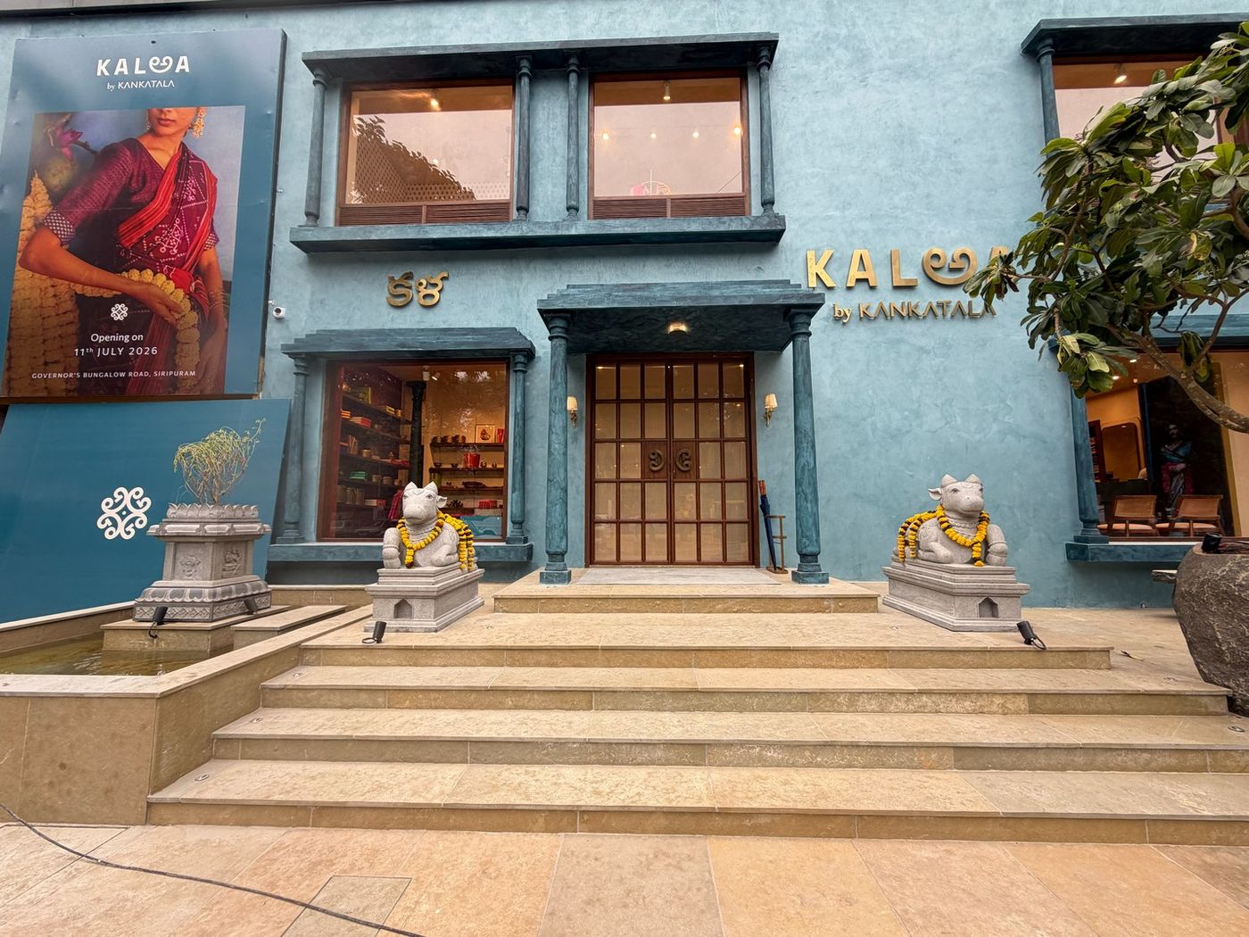 The blue facade and stone steps of KALఅA by Kankatala on Governors Bungalow Road, Siripuram, Visakhapatnam
